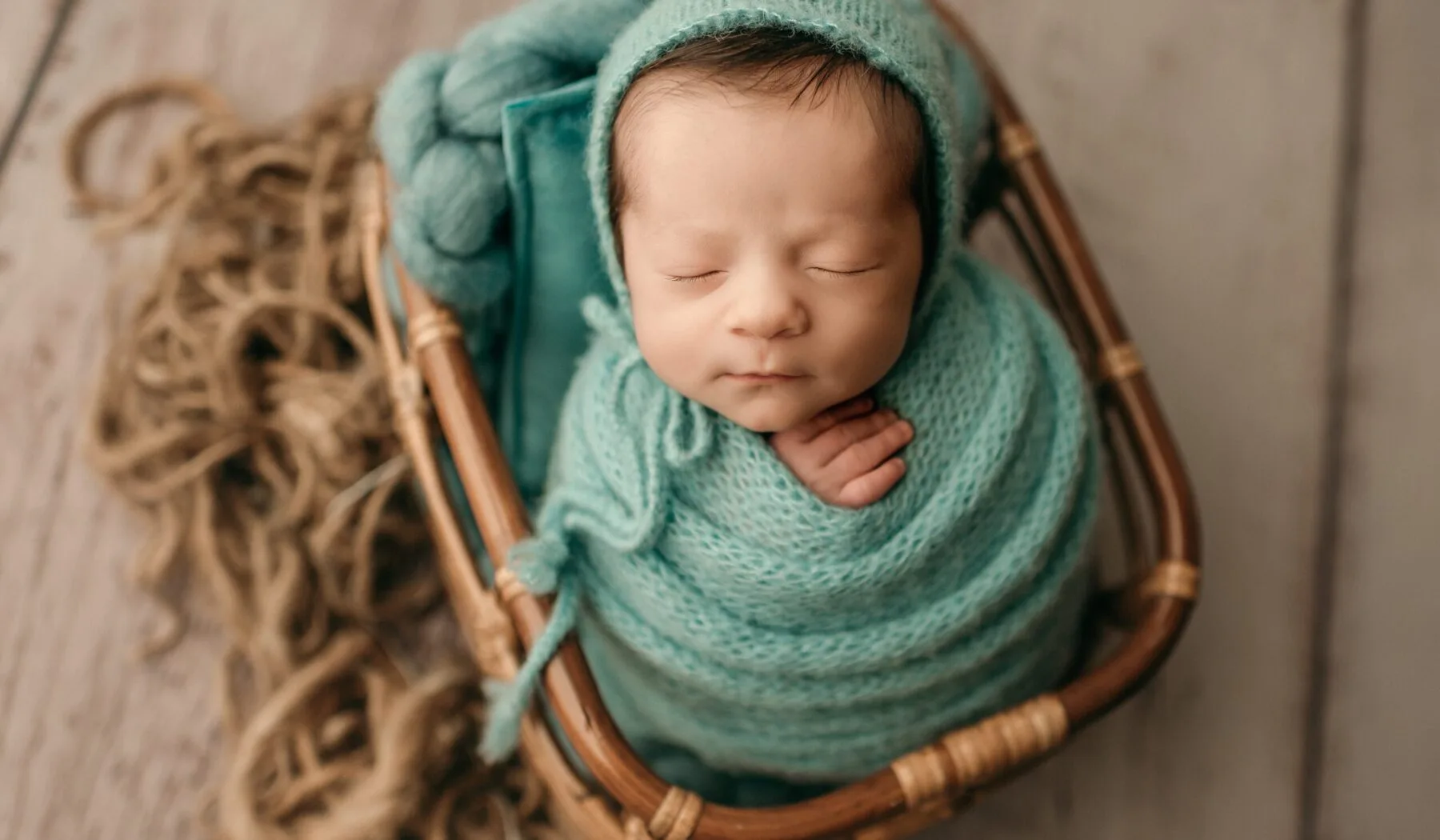 newborn baby boy in a basket.